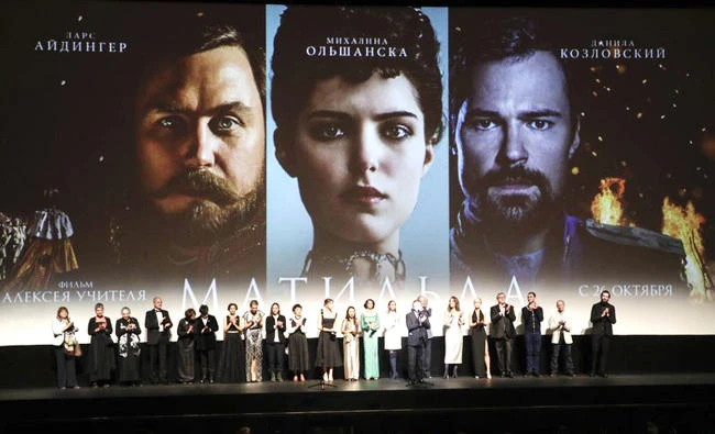 Alexei Uchitel, Russian film director of ‘Matilda,’ a movie about the last Russian czar’s affair with a ballerina and his movie crew applaud at the stage at the Mariinsky Theater in Moscow on Monday. (AP)