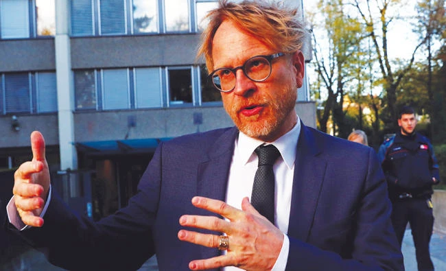 Andre Marty, spokesman for the Swiss attorney general in front of the office where Al-Khelaifi was questioned. (Reuters)
