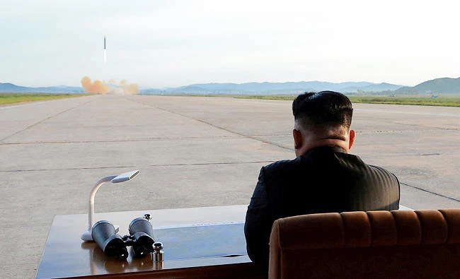 North Korean leader Kim Jong Un watches the launch of a Hwasong-12 missile in this undated photo released by North Korea's Korean Central News Agency (KCNA) on September 16, 2017. (REUTERS)