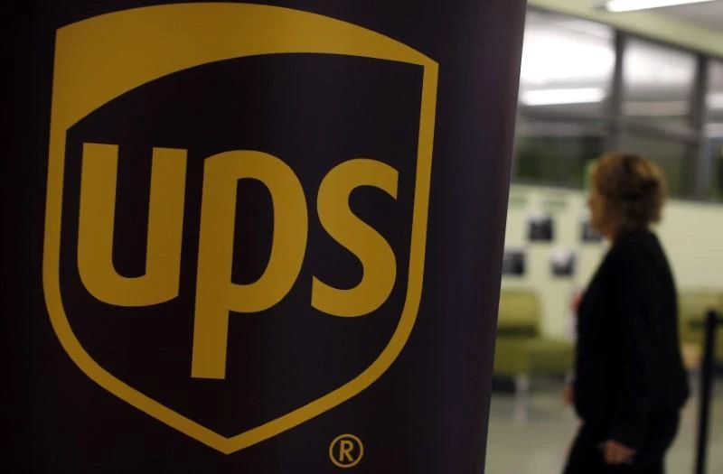 UPS results hit by hurricanes, buoyed by overseas shipments