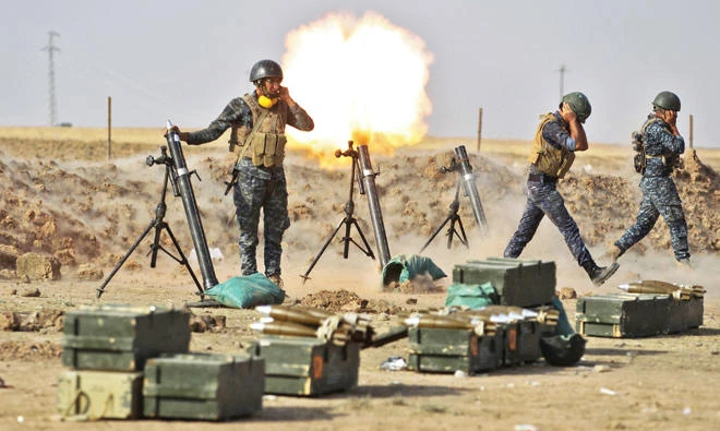Iraqi forces fire mortars on Thursday against Kurdish Peshmerga positions near an area located on the Turkish and Syrian borders in the Iraqi Kurdish autonomous region. (AFP)