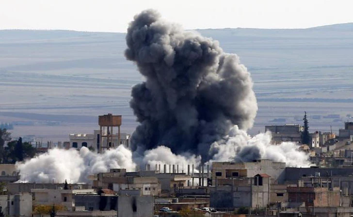 An explosion following an air strike is seen in western Kobani neighborhood on November 23, 2014. (File photo by Reuters)