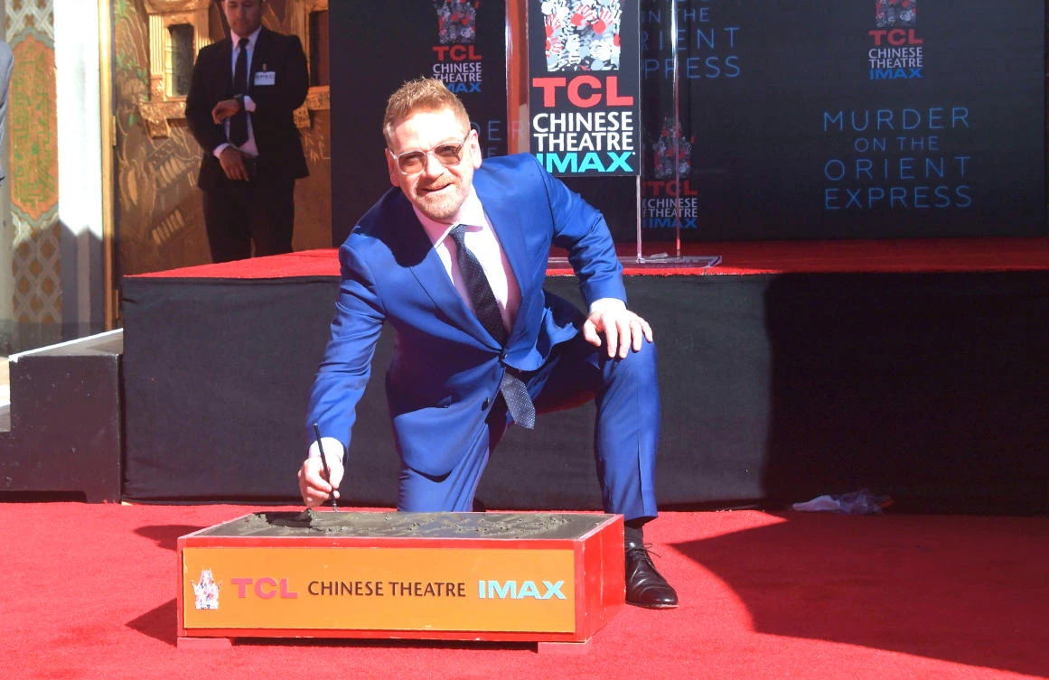 Actor Kenneth Branagh poses while putting his name, hand and foot prints into a block of cement in Los Angeles, on Thursday. (AFP)