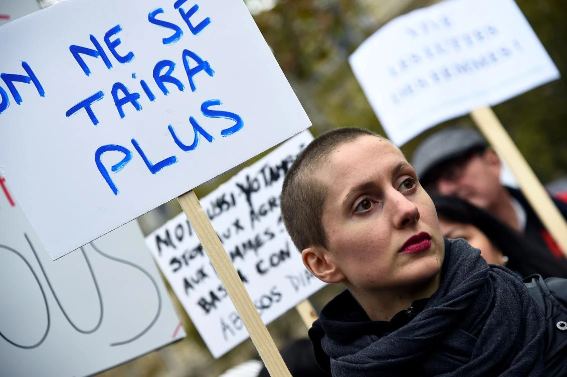 A women holds a placards reading "We will not be silent anymore" during a gathering against gender-based and sexual violence called by the Effronte-e-s Collective, on the Place de la Republique square in Paris. (AFP)