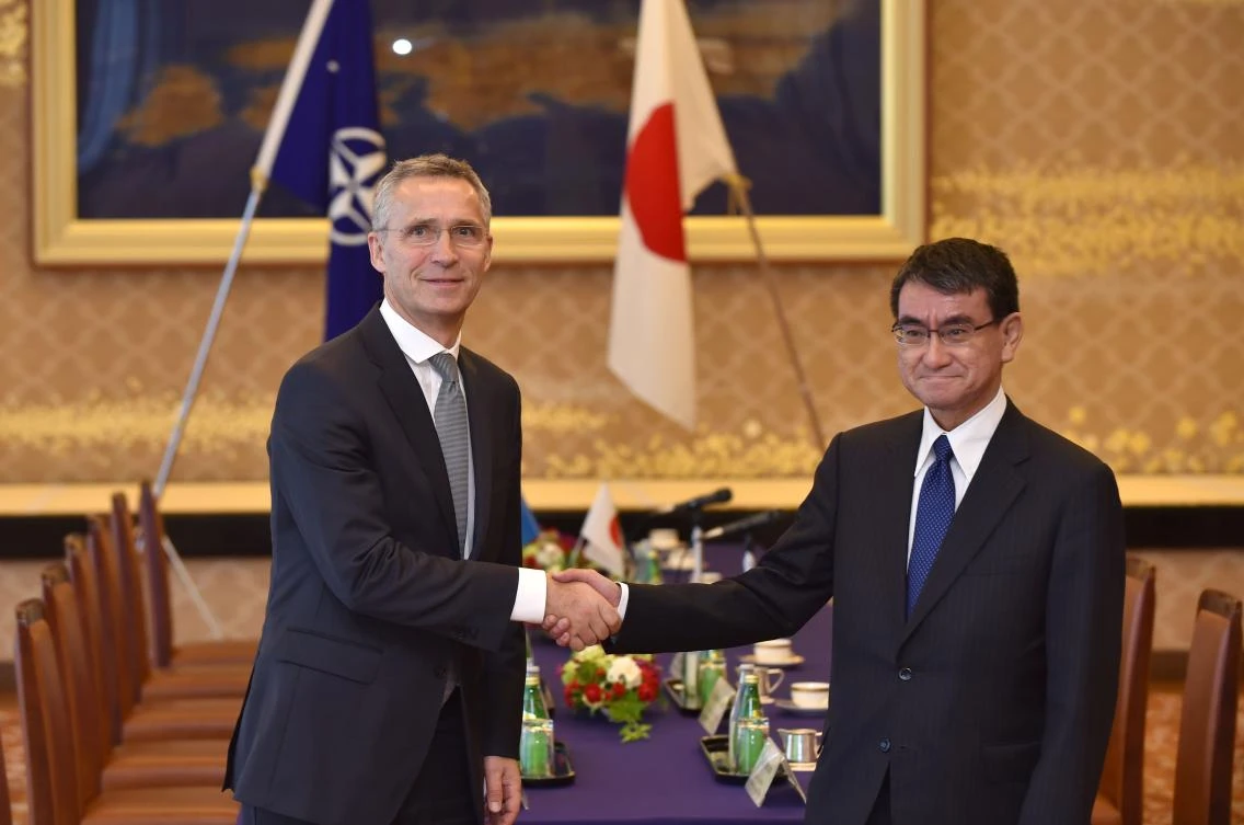 NATO Secretary General Jens Stoltenberg (L) shakes hands with Japan’s Foreign Minister Taro Kono at the Iikura guest house in Tokyo on October 30, 2017. (AFP)