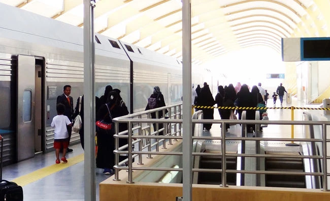 Passengers board a new train service from the Saudi Railway Company at a station on the edge of the Saudi capital Riyadh, in this June 9, 2017 photo. (AFP)