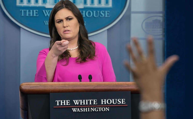 Trump distances himself from indicted former aides