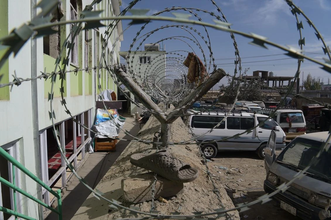In this photograph taken on October 23, 217 a sandal belonging to a victim hanging on barbed wire outside the Imam Zaman Shiite mosque after a suicide attack during Friday evening prayers, in Kabul. (AFP)