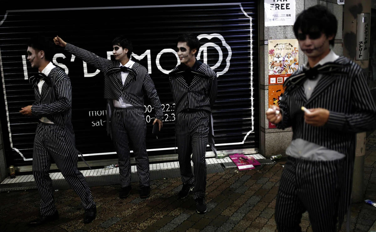 This file photo shows men wearing costumes in a street during a Halloween parade in Tokyo on October 29, 2017. (File photo by AFP)