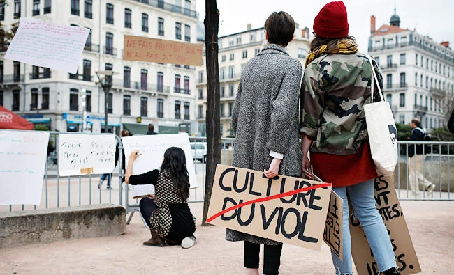 A woman holds a banner reading 'Rape culture' during a demonstration to support the wave of testimonies denouncing cases of sexual harassment, in Lyon, central France, in this Oct. 29, 2017 photo. (AP)