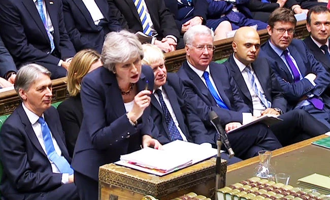 A still image taken from footage broadcast by the UK Parliament's Parliamentary Recording Unit (PRU) shows Britain's Prime Minister Theresa May as she speaks during the weekly Prime Minister's Questions (PMQs) session in the House of Commons in London, in this October 25, 2017 photo. (AFP)