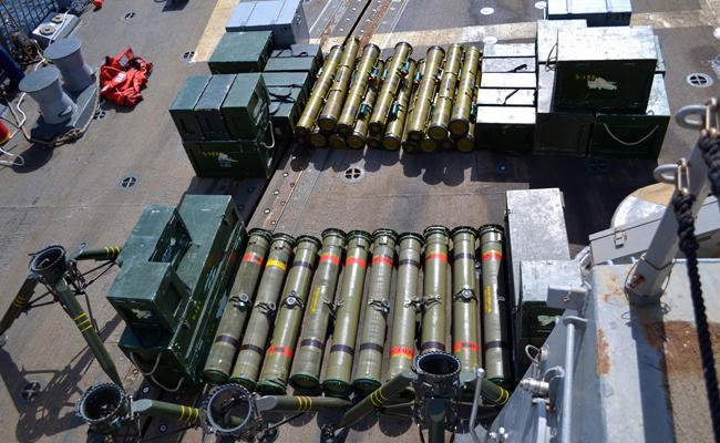 Weapons and equipment, believed to be from Iran, are displayed aboard the deck of USS Forrest Sherman after they were seized from a smuggling boat off the coast of Yemen. Nawfal Jawad alleged that the substances were transferred to the Houthis through maritime smuggling networks operated by the IRGC. (AP/File)