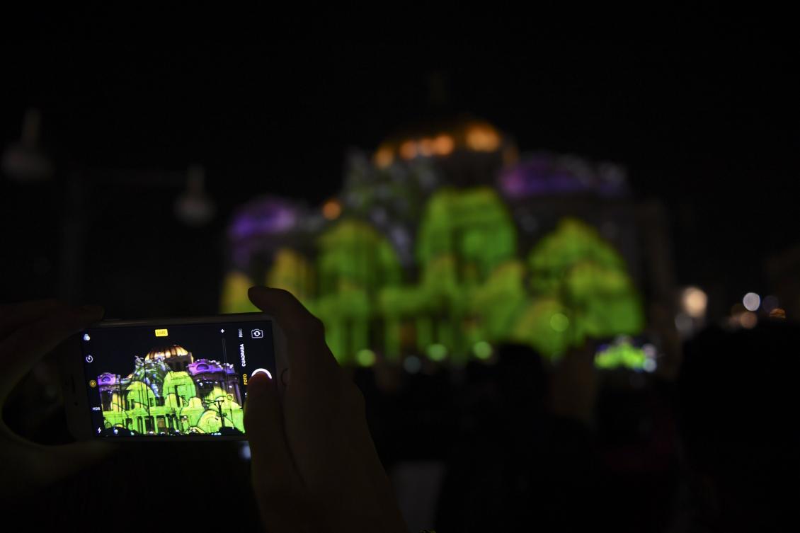 The Palace of Fine Arts is illuminated during a light show as part of the International Festival of Lights (FILUX) in Mexico City, on November 16, 2017. / AFP / PEDRO PARDO