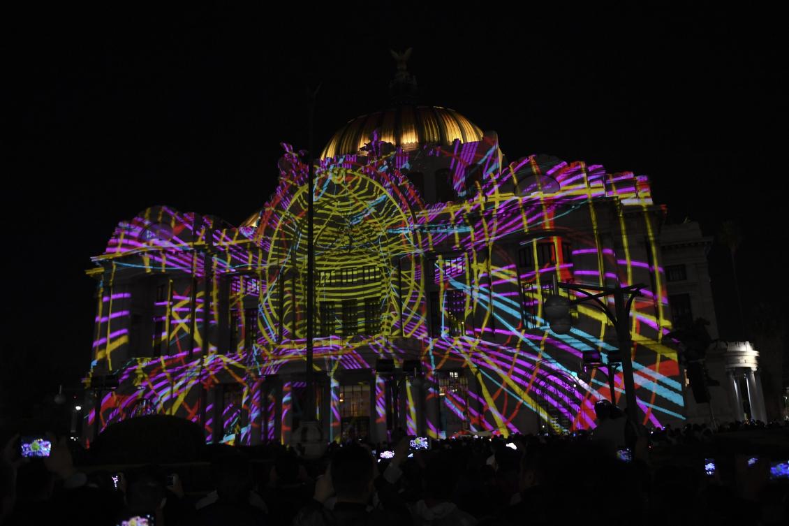 The Palace of Fine Arts is illuminated during a light show as part of the International Festival of Lights (FILUX) in Mexico City, on November 16, 2017. / AFP / PEDRO PARDO