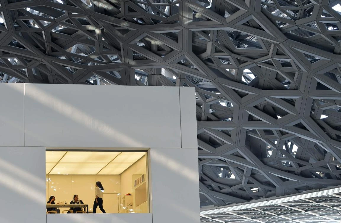 A general view shows part of the Louvre Abu Dhabi Museum designed by French architect Jean Nouvel on November 11, 2017 during its official opening to public on Saadiyat island in the Emirati capital. More than a decade in the making, the Louvre Abu Dhabi opened its doors bringing the famed name to the Arab world for the first time. - RESTRICTED TO EDITORIAL USE - MANDATORY MENTION OF THE ARTIST UPON PUBLICATION - TO ILLUSTRATE THE EVENT AS SPECIFIED IN THE CAPTION / AFP / GIUSEPPE CACACE / RESTRICTED TO EDITORIAL USE - MANDATORY MENTION OF THE ARTIST UPON PUBLICATION - TO ILLUSTRATE THE EVENT AS SPECIFIED IN THE CAPTION
