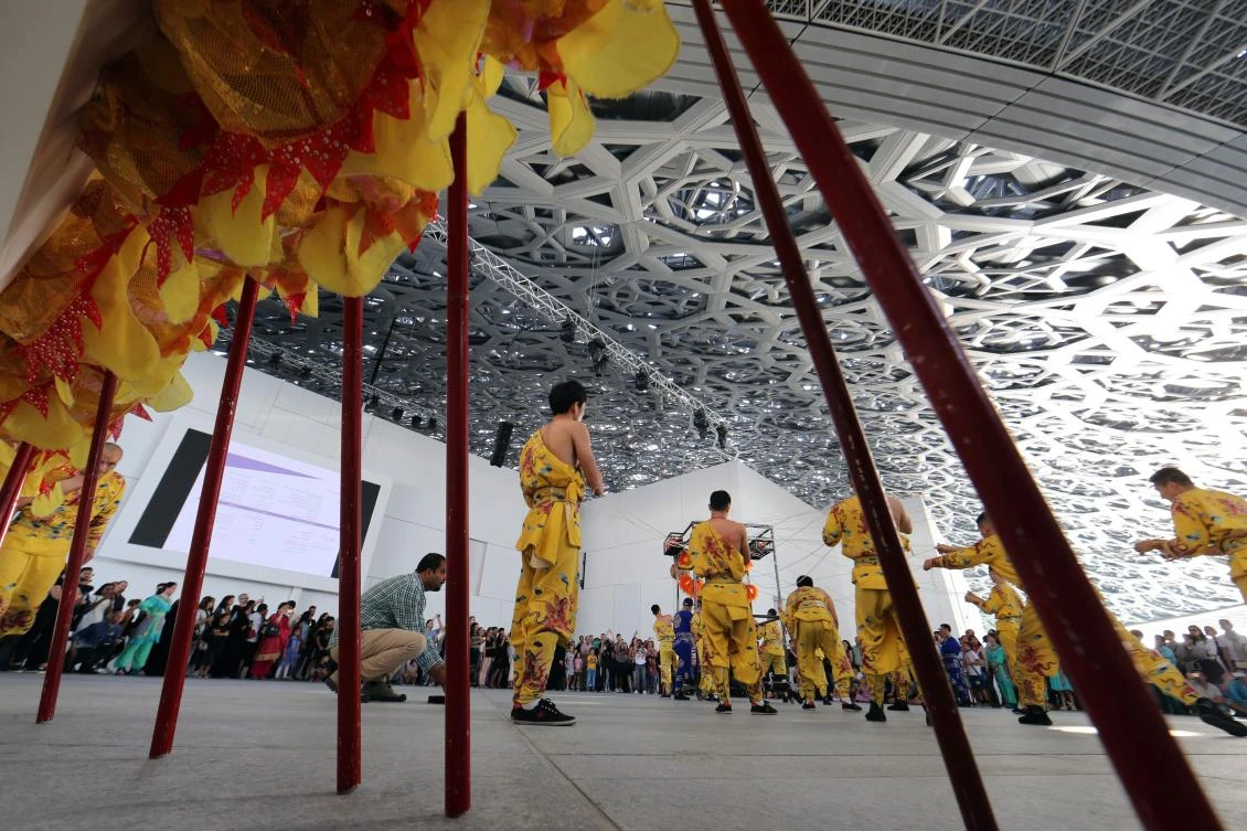 Dancers from Korean musical ensemble "Baraji" perform during the opening of the Louvre Abu Dhabi Museum on November 11, 2017 on Saadiyat island in the Emirati capital. / AFP / Karim SAHIB