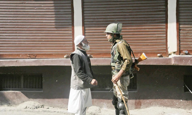 An Indian soldier questions a Kashmiri during a strike in Srinagar, Indian controlled Kashmir, in this file photo. (AP)