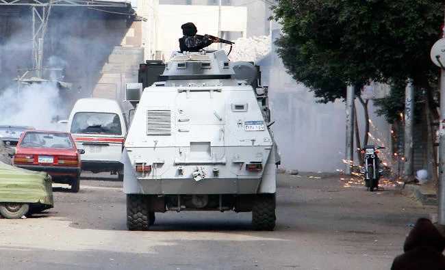 Egyptian security forces fire in the Cairo suburb of Matariyah, Egypt, in this Jan. 25, 2015 file photo. (AP)
