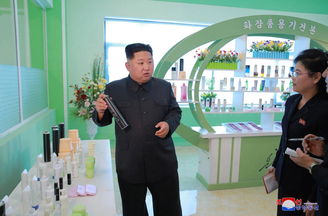North Korean leader Kim Jong Un and wife Ri Sol Ju visit a cosmetics factory in this undated photo released by North Korea’s Korean Central News Agency (KCNA) in Pyongyang. (Reuters)