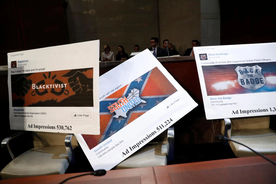 Examples of Facebook pages are seen, as executives appear before the House Intelligence Committee on November 1 to answer questions related to Russian use of social media to influence US elections, on Capitol Hill in Washington. (Reuters)