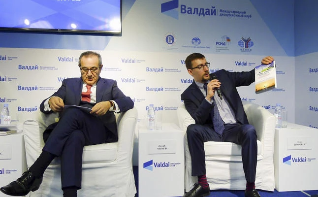 In this handout photo taken on April 19, 2016, released by Valdai Club foundation, shows Ivan Timofeev, right, and Joseph Mifsud, attend the Valdai Discussion Club Conference following the results of the closed-door Iran-Russia discussion in Moscow, Russia. (valdaiclub.com via AP)