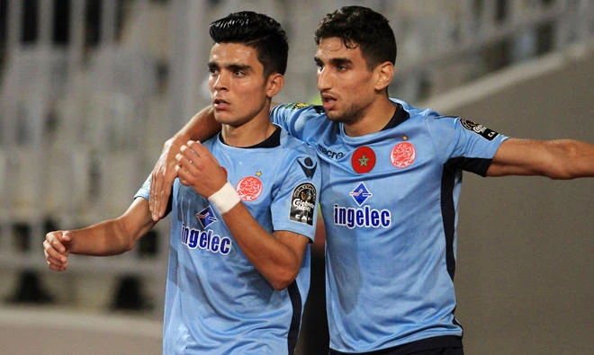 Achraf Bencharki (left) to get the goals to lead the Moroccan outfit to glory. (AFP)