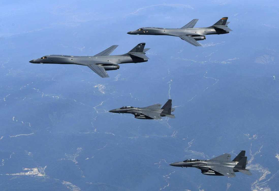 Above, US Air Force B-1B bombers, top, and South Korean fighter jets F-15K, second from top, fly over the Korean Peninsula, South Korea. The B-1B bombers based in Guam were escorted by two South Korean F-16 fighter jets during the drills Thursday at a field near the South’s eastern coast. (South Korean Defense Ministry via AP)