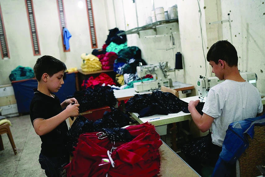 Syrian refugee boys seen working at a small textile factory in Gaziantep, Turkey, in this July 2016 file photo. (Reuters)