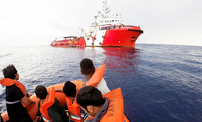 Migrants rescued by "Save the Children" NGO crew approach the ship Vos Hestia in the Mediterranean sea off Libya coast, in this June 18, 2017 photo. (REUTERS)