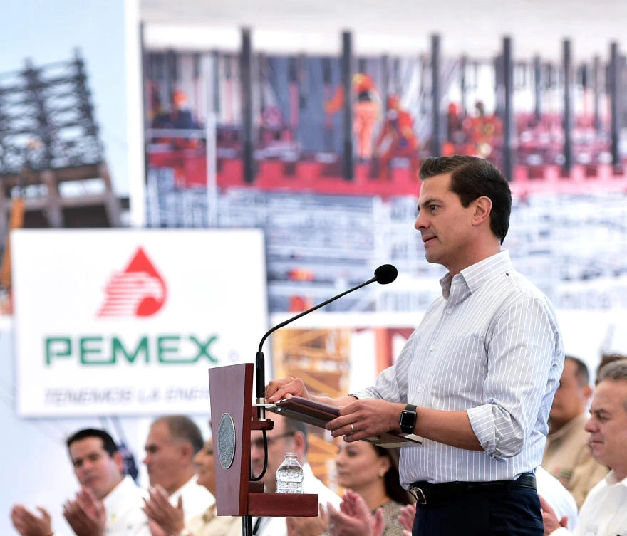 President Enrique Pena Nieto said Pemex made the discovery by drilling its onshore Ixachi well, and that the overall field is believed to hold some 350 million barrels of proven, probable and possible reserves. (Mexican Presidency / AFP)