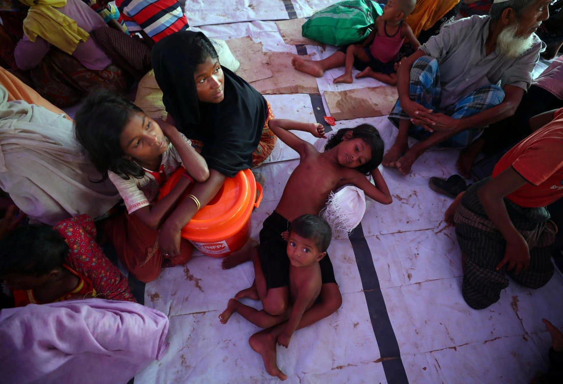 Above, Rohingya refugees who crossed the border from Myanmar rest at a temporary shelter in the Balukhali refugee camp near Cox’s Bazar, Bangladesh. The United States has been careful to say it holds the military responsible for deadly violence that has prompted more than 600,000 people to flee Myanmar. (Reuters)