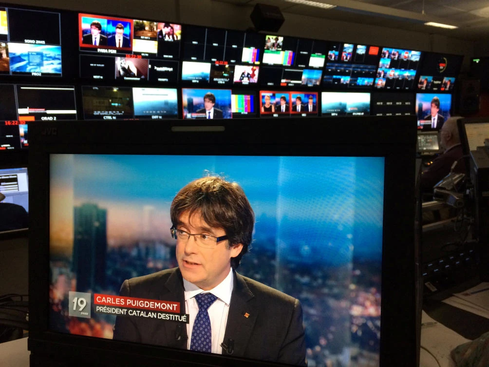 Ousted Catalan President Carles Puigdemont appears on a monitor during a live TV interview at the Belgian RTBF studio in Brussels. (RTBF Television via Reuters)