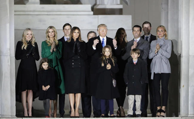 In this Jan. 19, 2017, file photo, then-President-elect Donald Trump and his wife Melania Trump and family wave at the conclusion of the pre-Inaugural "Make America Great Again! Welcome Celebration" at the Lincoln Memorial in Washington.(AP Photo/David J. Phillip. File)