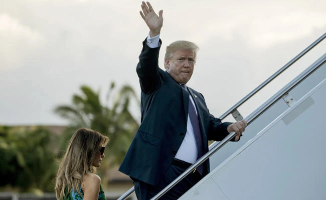 President Donald Trump and first lady Melania Trump board Air Force One at Joint Base Pearl Harbor Hickam, Hawaii, on Saturday, Nov. 4, 2017, to travel to Yokota Air Base in Fussa, Japan. (AP Photo/Andrew Harnik)