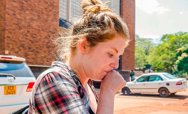 US citizen, Martha O'Donovan, who was arrested for undermining the authority of Zimbabwe President Robert Mugabe on Twitter, arrives at Harare Magistrate's Court in Harare on Saturday. (AFP)