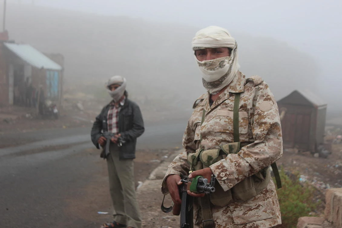 Above, local militias man a checkpoint against Houthi rebels. More than 10,000 people have been killed in Yemen’s conflict since the Houthis advanced on Aden. (Reuters)