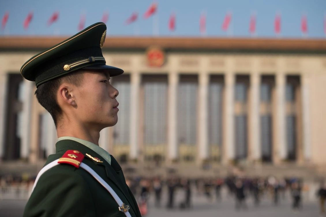 A paramilitary policeman stands guard at Tiananmen square during the closing session of the 19th Communist Party Congress in Beijing. (AFP/Nicolas Asfouri)