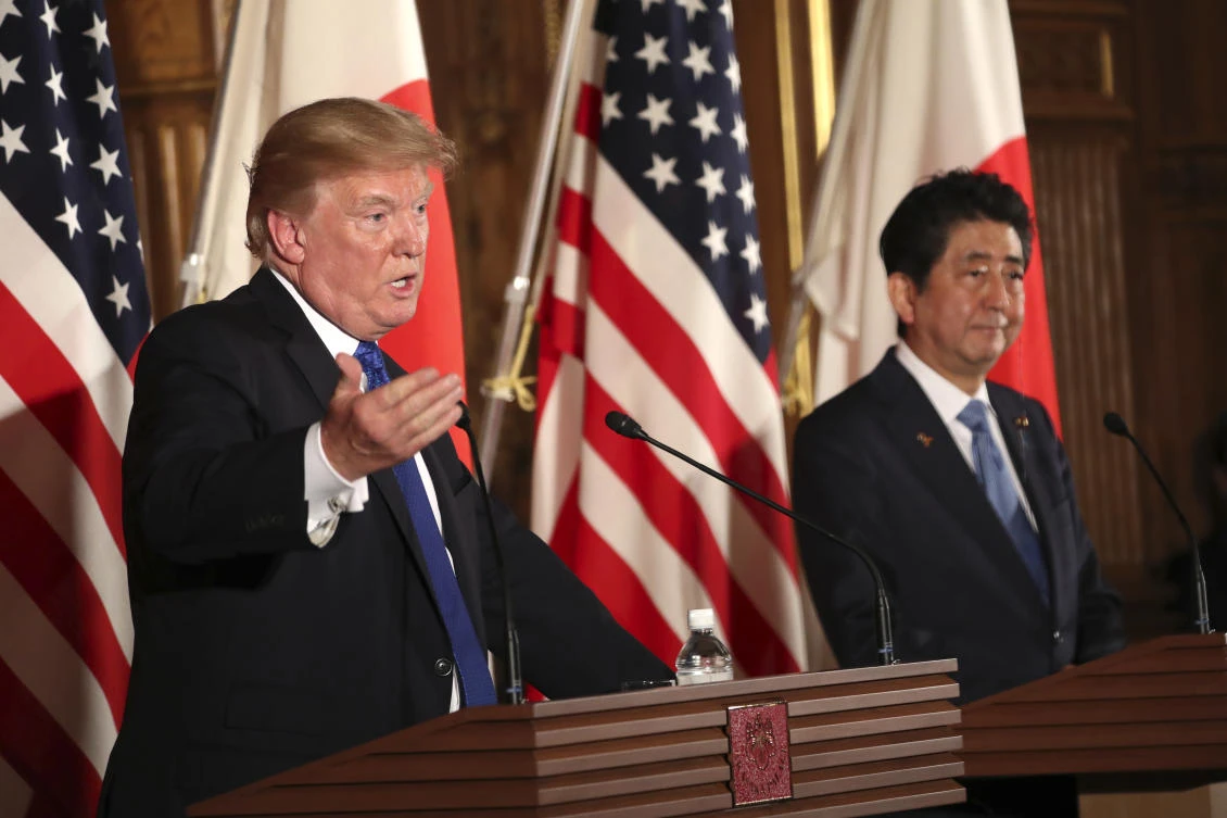 President Donald Trump, left, speaks as Japanese Prime Minister Shinzo Abe, right, looks on during a joint news conference at the Akasaka Palace, Monday, Nov. 6, 2017, in Tokyo. (AP/Andrew Harnik)