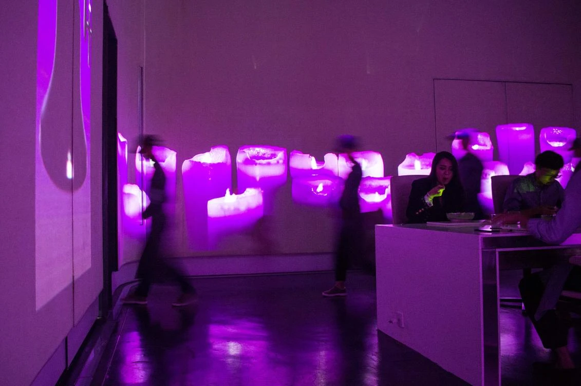 Staff members of Ultraviolet restaurant serve their guests inside the dining room in Shanghai. A van spirits Ultraviolet restaurant’s ten nightly diners to its secret Shanghai location where they enter a minimalist dining room to Wagner’s theme from “2001: A Space Odyssey.” French chef Paul Pairet immerses guests in a 360-degree parade of sights, sounds and smells tailored to evoke a matching sense of “place” for each dish in one of the most unique — and expensive — dining experiences on the planet. (AFP/Chandan Khanna)