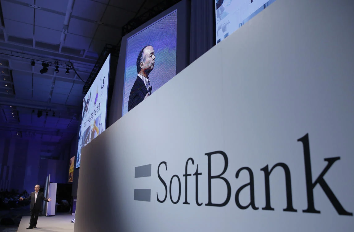 SoftBank Group Corp. Chief Executive Officer Masayoshi Son, left, speaks during a SoftBank World presentation at a hotel in Tokyo. (AP /Shizuo Kambayashi, File)