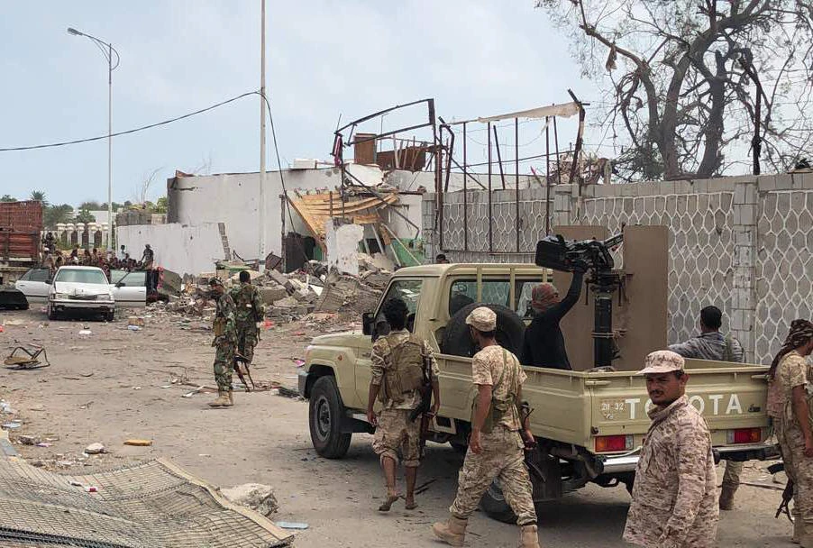 Yemeni men and security forces inspect the site of a suicide bombing in the southern port city of Aden, on Nov. 5, 2017. Al-Qaeda suspects carried out twin suicide bombings and took hostages, officials said, as they struck at the heart of the Yemeni government after suffering a string of setbacks. (AFP)