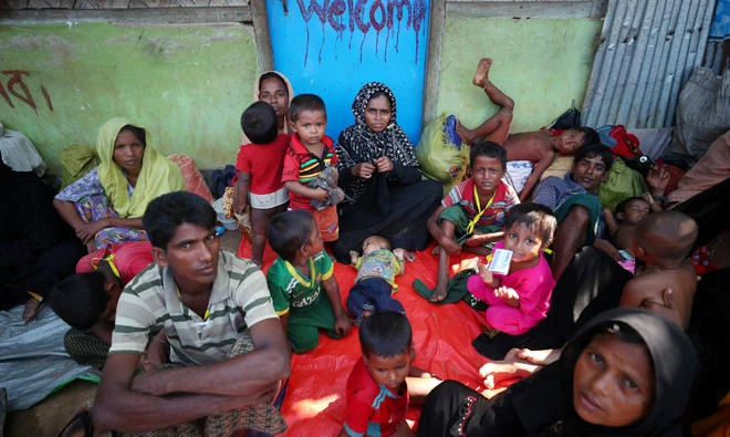 Rohingya refugees wait on the street of a refugee camp near Cox’s Bazar, Bangladesh. (Reuters)