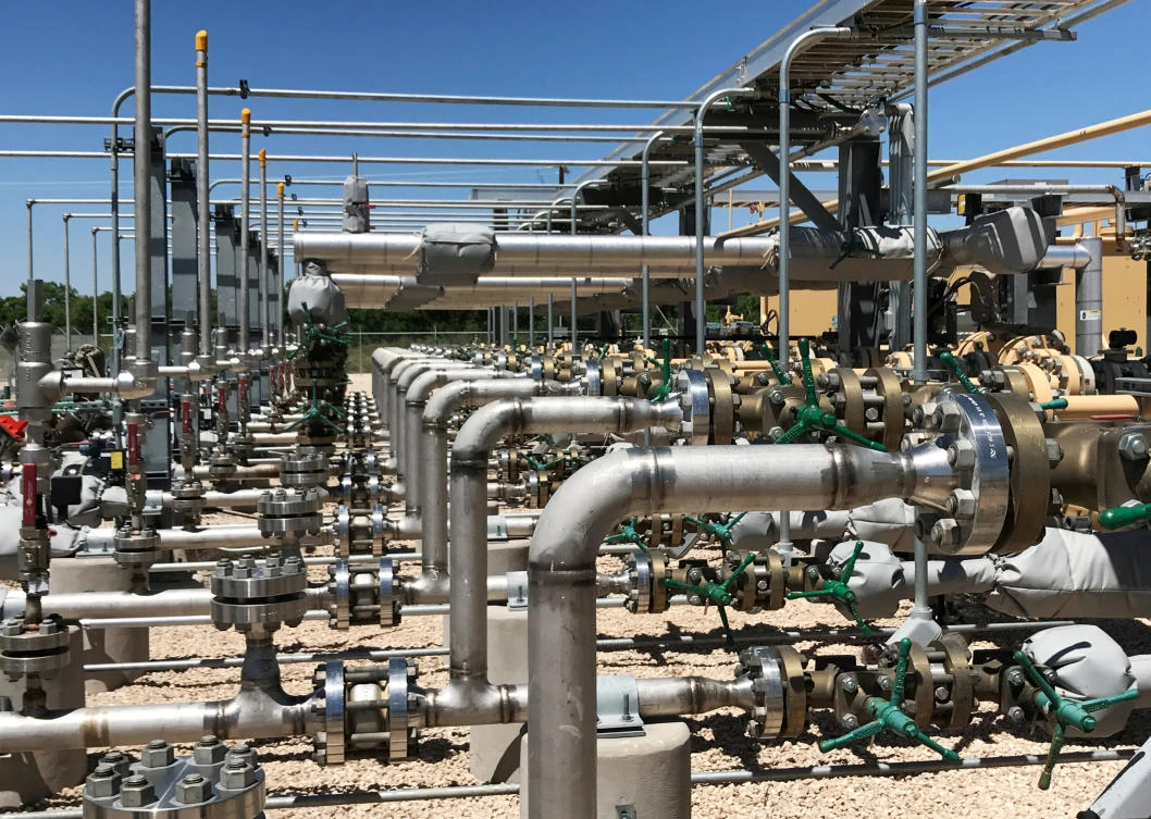 Equipment used to process carbon dioxide, crude oil and water is seen at an Occidental Petroleum Corp. enhanced oil recovery project in Hobbs, New Mexico, US. (Reuters/Ernest Scheyder/File Photo)