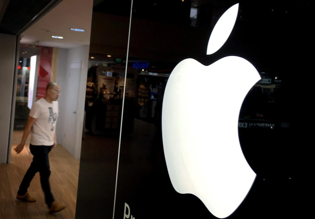 A man walks into one of Apple’s authorized premium resellers’ outlets in Singapore. (AP/Wong Maye-E, File)