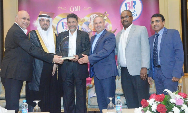 From left, Mohammed Yahya Kazi, member of the executive committee of the board of directors of GICC; Shabeer Shah, general manager of GICC; Bill Mitchell, president of Dunkin’ Brands International; John Varghese, vice president of Dunkin’ Brands International; and Osama Saleh Yadkar, deputy general manager of JTCL.