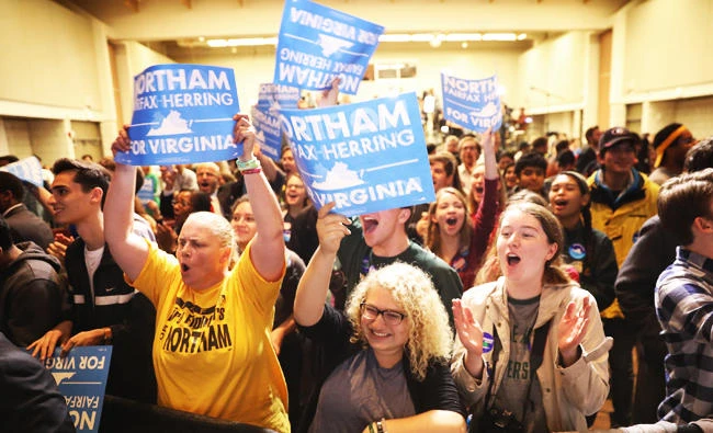 Supporters of Ralph Northam, the Democratic candidate for governor of Virginia, celebrate as early projections indicated a Northam victory at an election night rally on Tuesday in Fairfax, Virginia. (AFP)