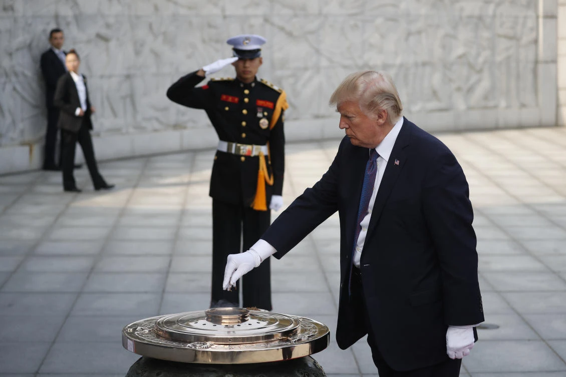 US President Donald Trump burns incense at the National Cemetery in Seoul, South Korea, Wednesday, Nov. 8, 2017. President Trump delivered a sharp warning to North Korean leader Kim Jong Un on Wednesday, telling him the weapons he’s acquiring “are not making you safer. They are putting your regime in grave danger.”(Kim Hong-Ji/Pool Photo via AP)