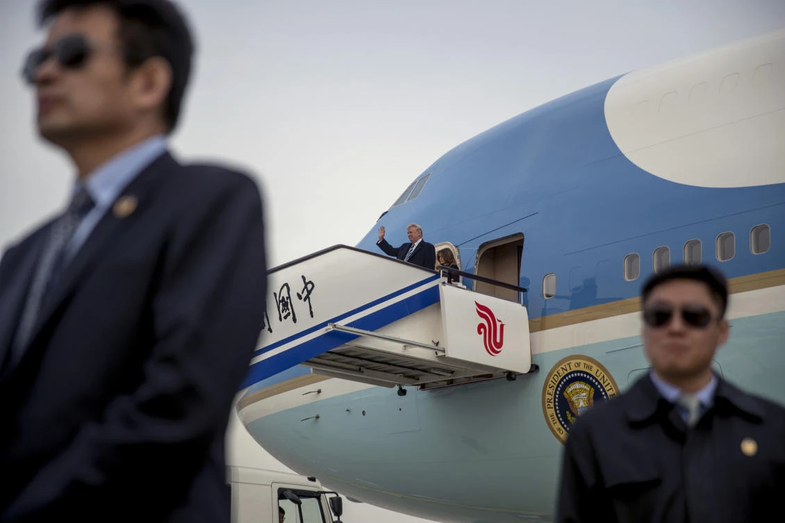 Chinese security guards stand on the tarmac as US President Donald Trump and first lady Melania Trump arrive at the Beijing Airport, Wednesday, Nov. 8, 2017, in Beijing, China. Trump is on a five country trip through Asia traveling to Japan, South Korea, China, Vietnam and the Philippines. (AP Photo/Andrew Harnik)