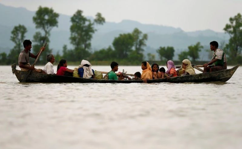 Rohingya refugees are seen on a boat as they are crossing border through the Naf river in Teknaf, Bangladesh on September 7, 2017. (File photo by Reuters)
