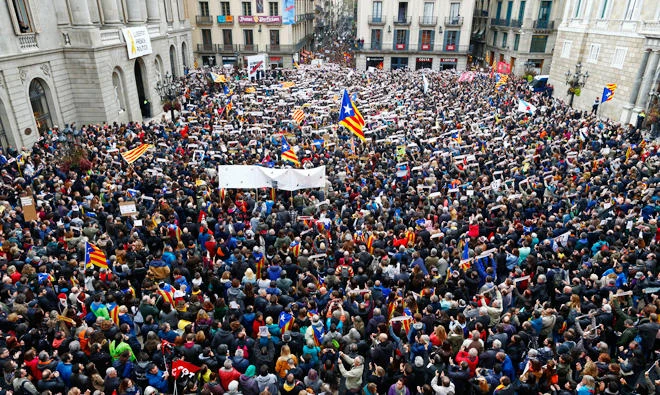 Thousands of pro-independence protesters rally outside the regional presidential palace in Barcelona, Spain, on Wednesday. (AP)